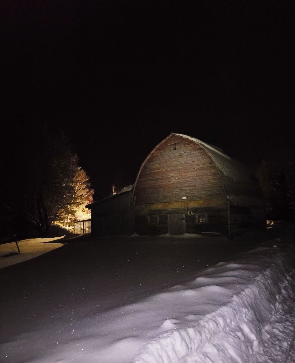 old barn at night in winter