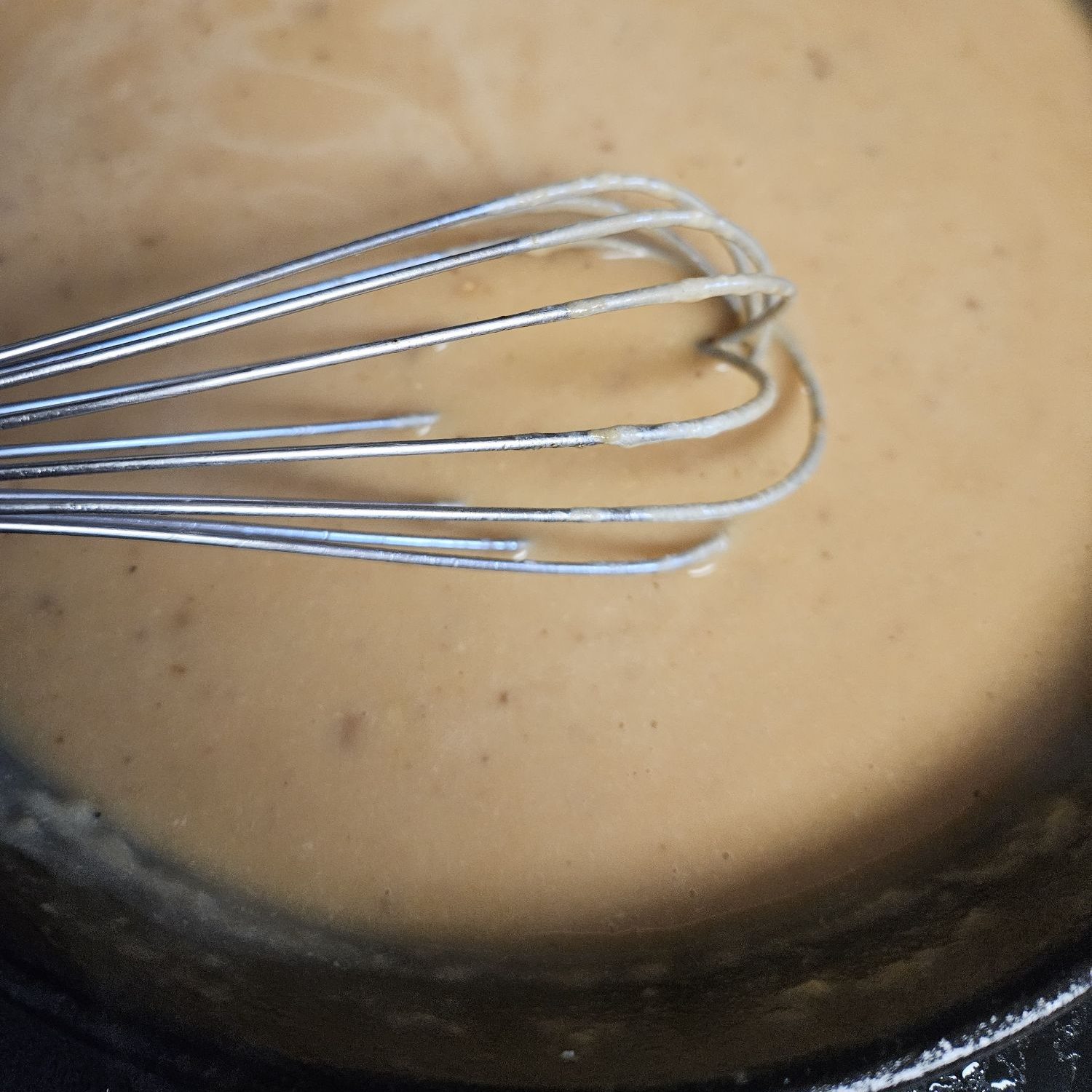 Whisking the lemon garlic sauce